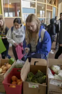 Students grab fruit and vegetables from a selection provided by the Gunnison Country Food Pantry.