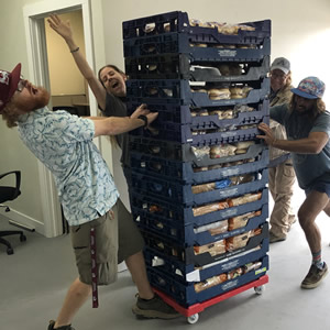 GCFP staff and volunteers move bread into the new Pantry.