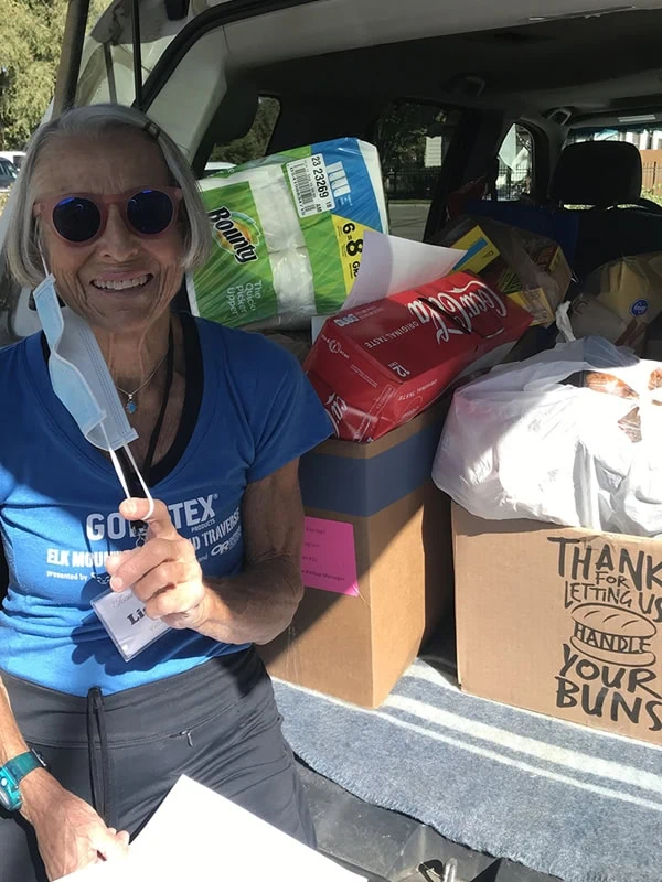 GCFP Volunteer delivering no cost groceries in a minivan.